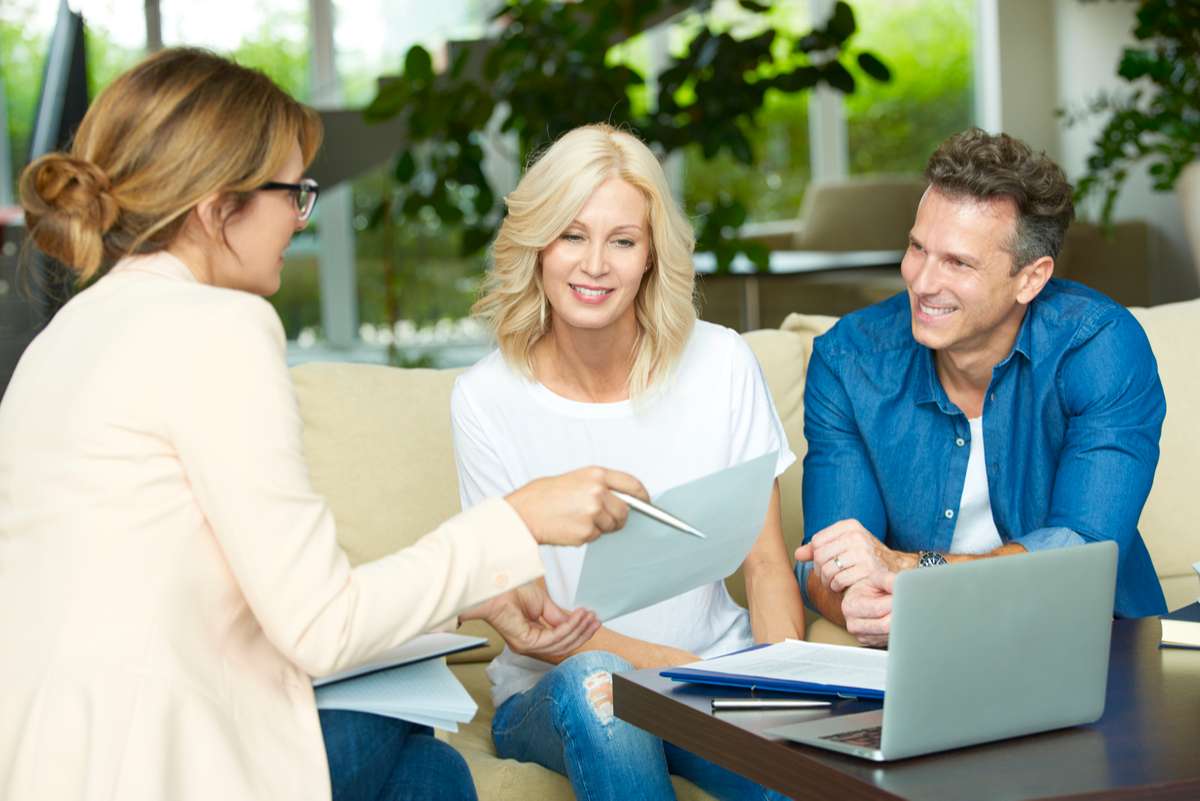 Couple consulting with real estate agent (R) (S)